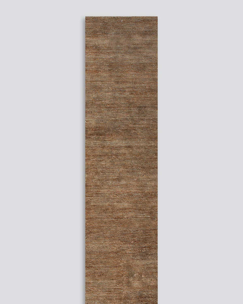 A full image of the Fairbanks floor runner in shade Sand, a deliciously warm toned brown handwoven piece with bamboo silk and jute. 