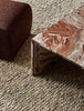 A textural wool blend boucle style rug by Globe West and Soren Liv NZ in shades of light grey and brown, situated in a stylish living room. 