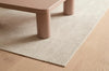 A stylish cream patterned floor rug set under a modern coffee table, by Globe West and Soren Liv nz