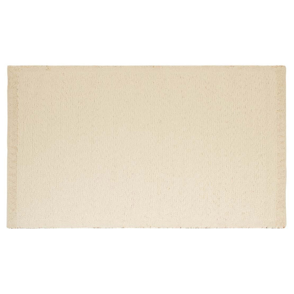 Full view from above of a textural wool blend boucle style rug by Globe West and Soren Liv NZ in shades of warm ivory and cream. 
