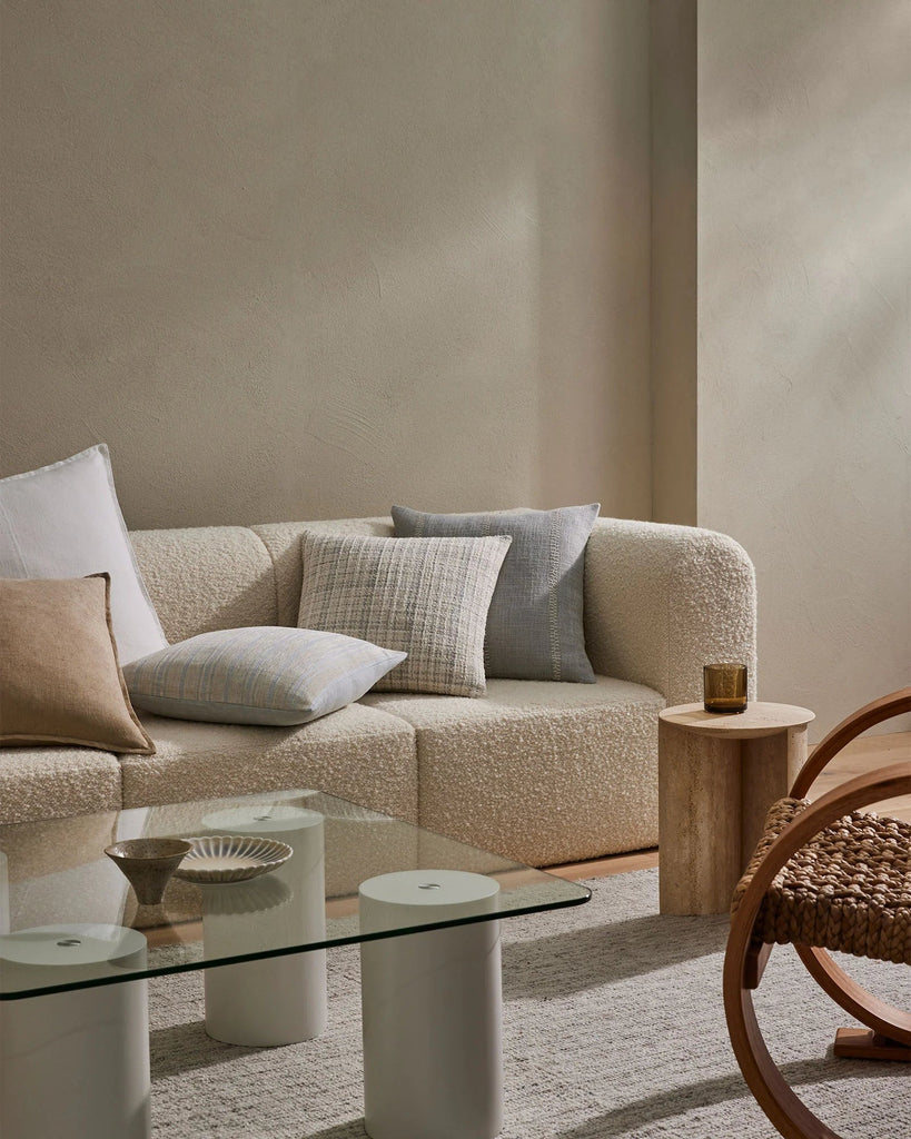 A beautiful neutral living room featuring new season Weave home decor - cushions and rug