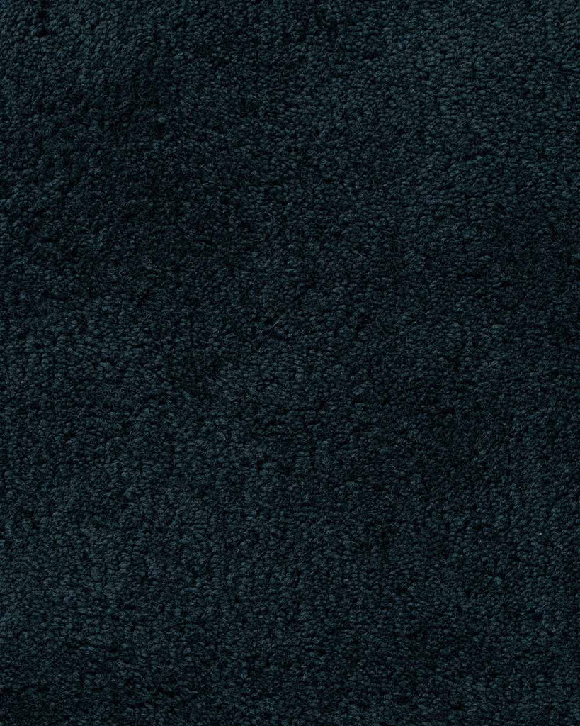 A close up of the weave, 100% wool, a deep navy blue luxuriously deep pile. 
