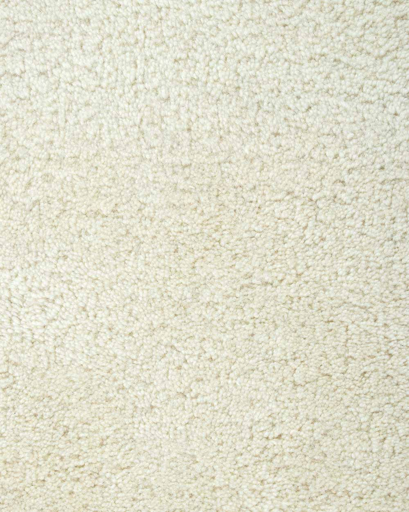 A close up of the weave of the Norfolk floor rug in Ivory. The luxurious depth of the pile and sumptuous warm cream colour make this rug a standout. 