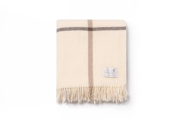 NZ wool throw blanket by Ruanui Station, featuring cream, beige and brown check