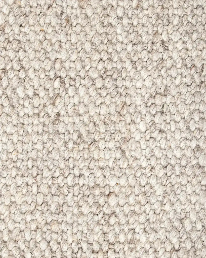 Close up of the Baya woven textural floor rug 'Omaha' in colour 'Pebble' 
