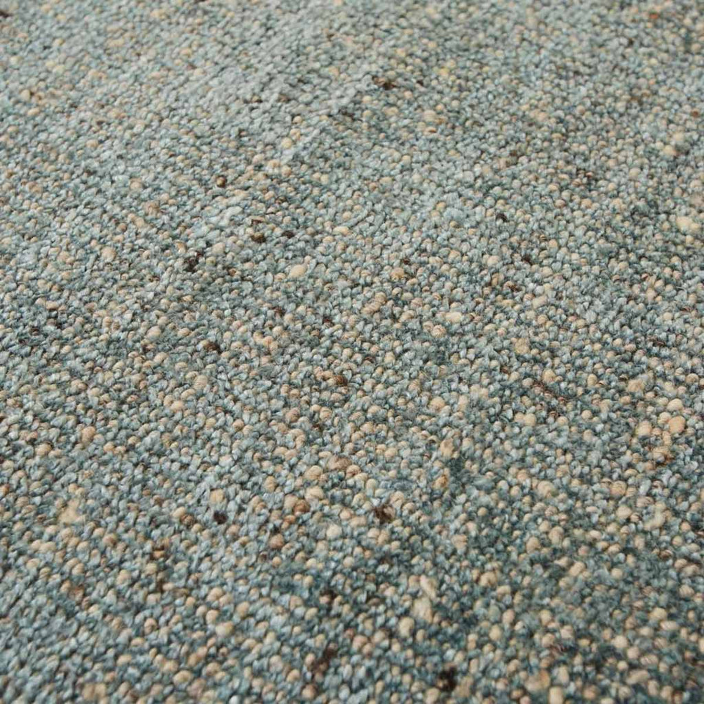 Close up of the weave of a viscose blend statement rug in shades of muted ocean blue, by Globe West and Soren Liv NZ.