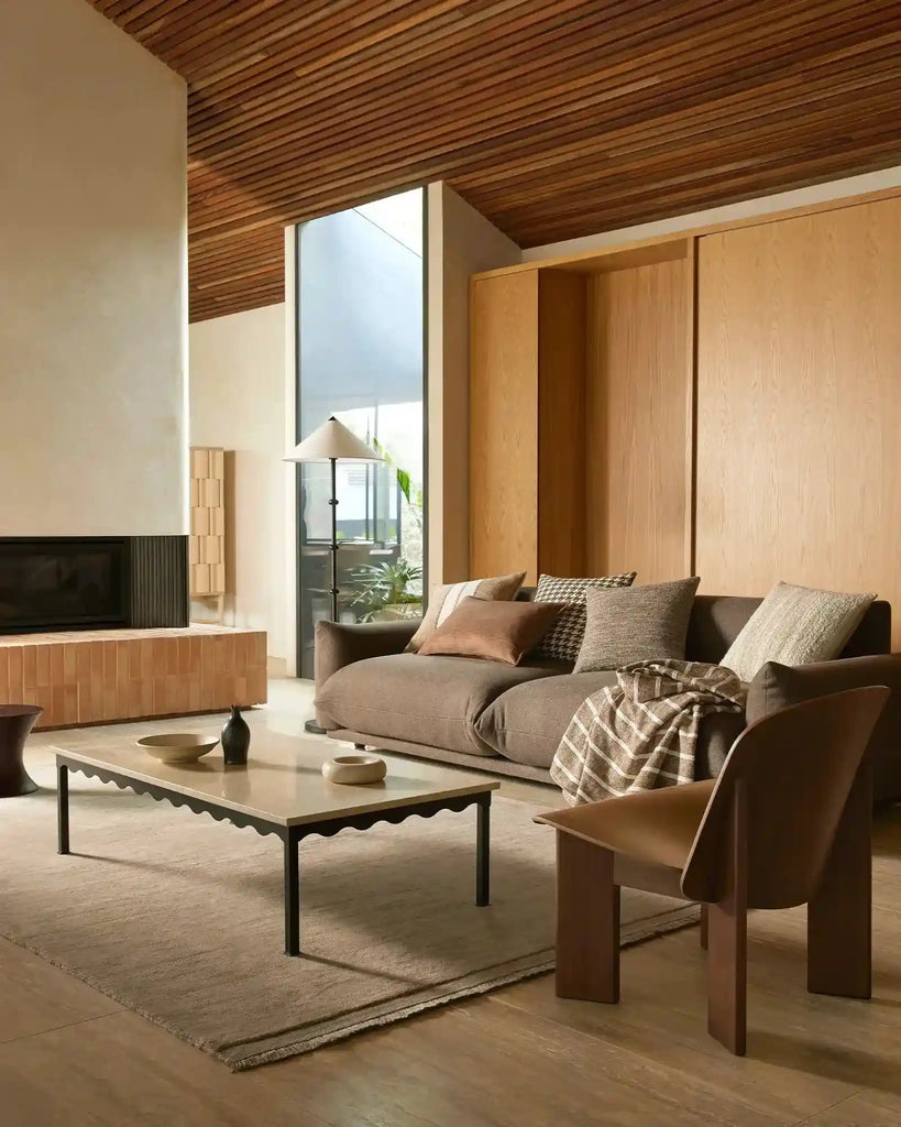 A stylish living room featuring Weave Home decor in warm brown shades