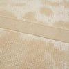 Detailed view showing the weave of a cream, light natural beige floor rug with geometric designs rendered in alternating pile heights, by Globe West and Soren Liv NZ.