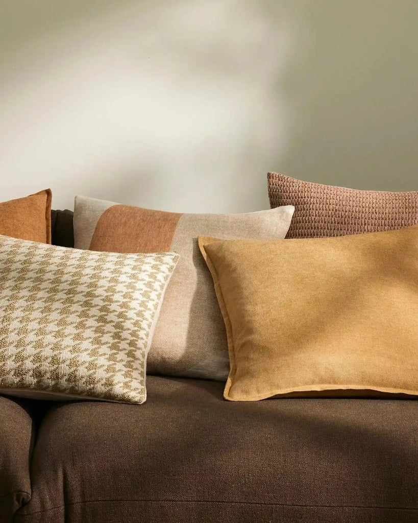 A selection of stylish cushions, in brown and mustard tones, by Weave Home nz