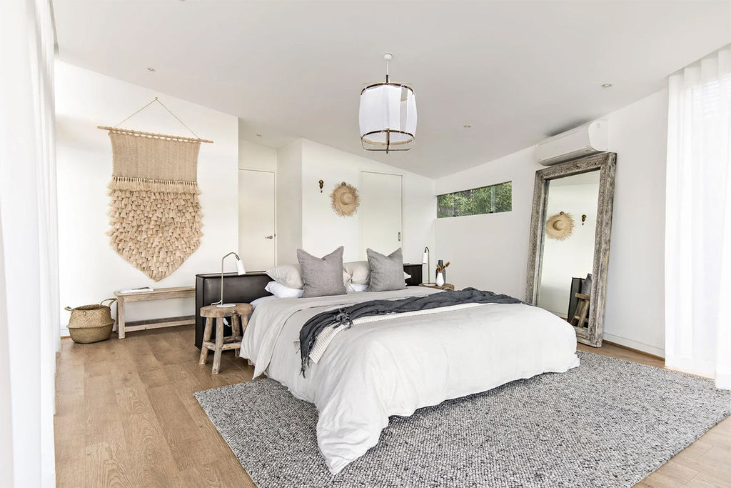 Stylish bedroom featuring Tribe Home nz Aero rug in colour silver